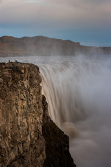Beautiful Icelandic waterfall at sunset with huge quantity of flowing waters Iceland