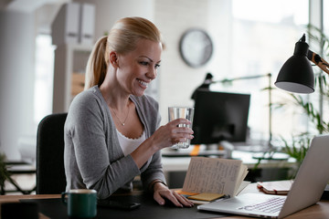 Young woman at work. Beautiful businesswoman working in office.	