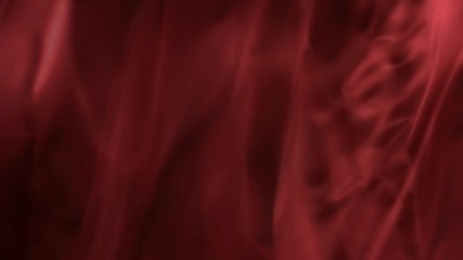 Smooth flowing luxury satin shiny red fabric - closeup shot