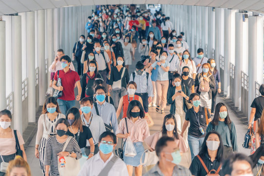 Bangkok City, Thailand : 03/12/2020 : Unidentified people, Crowd of Thai wearing face mask for health due to Coronavirus Disease or covid-19 and  air pollution in mass transit in public. Rush hour.