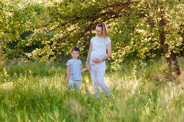 pregnant woman and child at a summer photo shoot