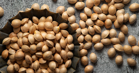 Ginkgo nuts in rusty metal tray 