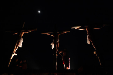 Matera, Balisicata, Italy: silhouette of actors during the representation of the crucifixion of...