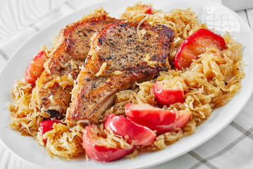 close-up of Pork Chops with Sauerkraut and Apples