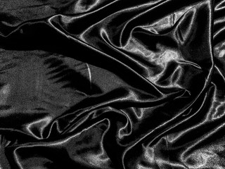luxury black silk or satin texture background with liquid wave or wavy folds. Wallpaper design