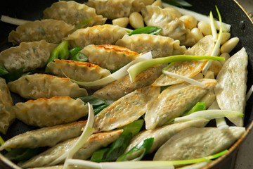 Pan fried dumpling with scallion and garlic