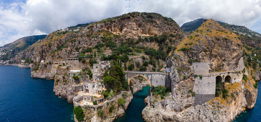 Aerial wide view panorama of the rocky seashore of southern Italy. Incredible beauty panorama of mountains and sea. Travel and tourism. Sunny summer day. Fiordo di furore beach. Praiano, Amalfi coast