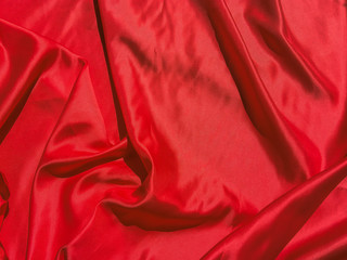 Red fabric texture for backgroundwith coy space. Valentines Day or Christmas Day wallpaper design