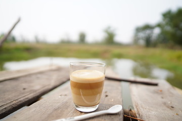 cup of coffee on wooden table