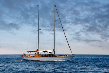 sailboat at sea under a magnificent sunset