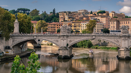 A bridge over the Tiber River near St. Peter's Basilica and the Vatican in Rome, Italy.