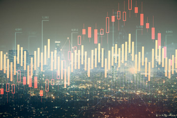 Naklejka premium Forex chart on cityscape with tall buildings background multi exposure. Financial research concept.