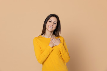 Attractive young girl wearing a yellow T-shirt