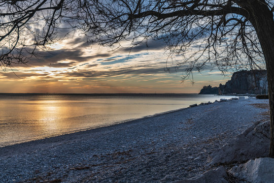 Winter sunset over the bay of Portopiccolo Sistiana. Duino. Italy