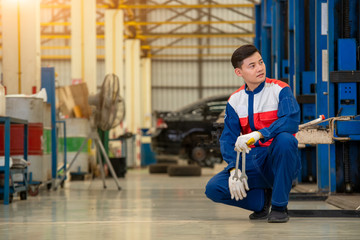 Fototapeta premium Mechanic and tools for car repair,Car service, repair, maintenance car concept.