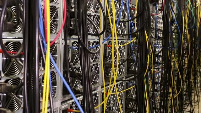Fiber optic equipment in a data center, IT and modern technologies concept. Stock footage. Server room routers and fiber optical cables.