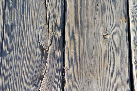 Natural gray wooden planks of a walking path