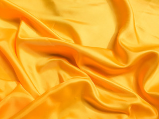 Obraz premium Yellow silk or satin texture background with copy space for design