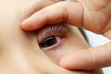 baby eye pupil iris opened two finger
