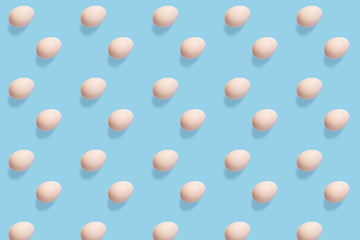 Beautiful eggs pattern on the flat background