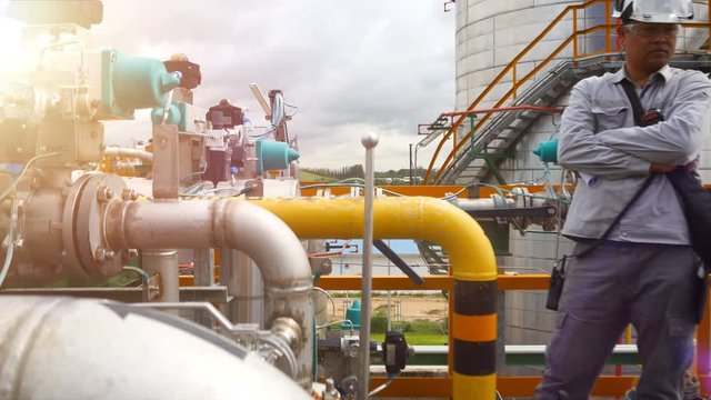 An engineer working production area of petroleum refinery plant