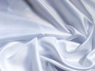 white crumpled fabric texture background. Silk curtain with fold waves for design