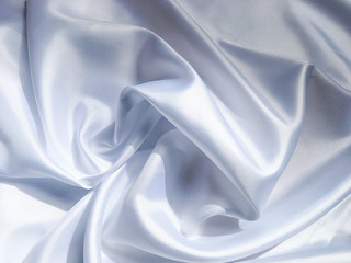 white crumpled fabric texture background. Silk curtain with fold waves for design