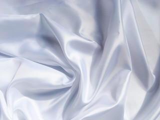 white crumpled fabric texture background. Silk curtain with fold waves for design