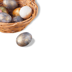 Easter colorful nacreous eggs in a basket. Isolated. Copy space.