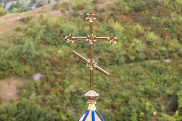 Obraz premium Close up on a cross of chapel on a hill near Saharna Monastery in Saharna village in Moldova
