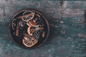 Tangerines, cones, spices on a wooden background. Сoncept of New Year and Christmas, Christmas drink Mulled wine. Flat lay, top view. Banner