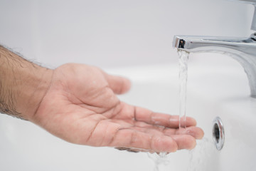 Close up man washing hands with soap cleaning water.