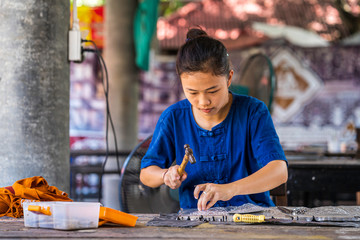 Silverware making. Thai craftman are making silverware. The original of the silver craftsmen on Wua...