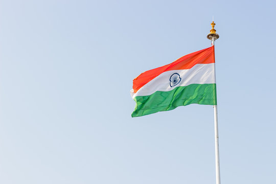 Indian flag flying high on a flagpost