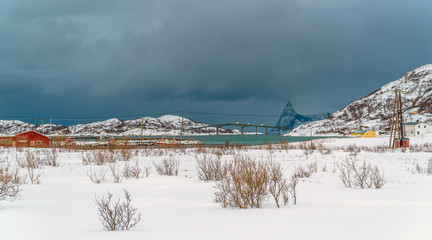 Sommarøy, Tromsø / Norway - March 6th, 2020: The Sommarøy Bridge in winter seen from the distance