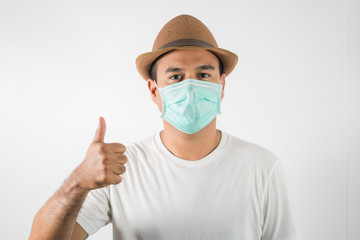 The young man had a cold and a fever. He wearing  protection mask. coronavirus or covid 19 concept.