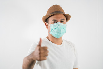 The young man had a cold and a fever. He wearing  protection mask. coronavirus or covid 19 concept.