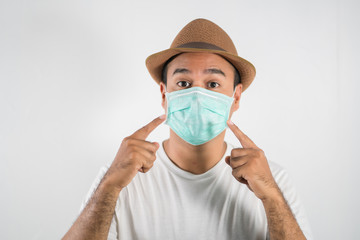 The young man had a cold and a fever. He wearing  protection mask. coronavirus or covid 19 concept.