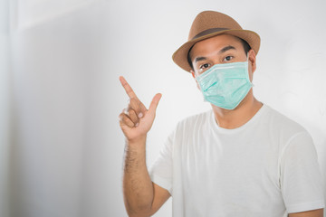 The young man had a cold and a fever. He wearing  protection mask. coronavirus or covid 19 concept.