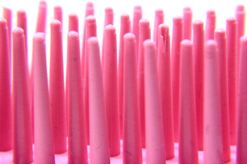 macro photo of pink hair comb