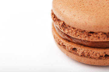 Chocolate macaroni cookies on a white background with brown filling, isolated.
