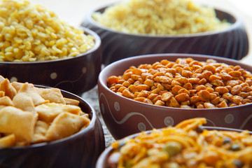 Close up of bowls with fried snacks
