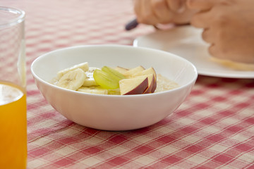 Woman preparing fruit salad
