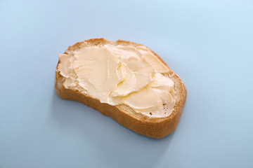 Bread and butter on blue background
