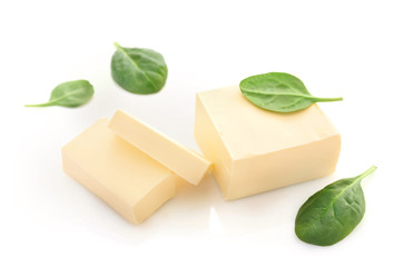 Butter and spinach isolated on white