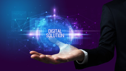 Man hand holding DIGITAL SOLUTION inscription, technology concept