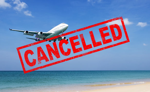 Flight Cancellation. Commercial Airplane Flight Over The Sea With Red Stamp Text Trip Cancelled From City Shutdown And Border Closed, Effect From COVID-19 Coronavirus Outbreak Situation