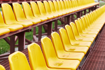 empty seats in the stands of a sports stadium.