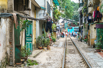 Fototapeta na wymiar Narrow train railroad in old town in Hanoi