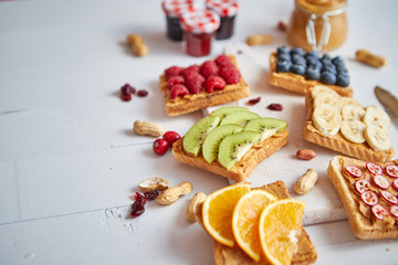 Obraz na płótnie Canvas Assortment of healthy fresh breakfast toasts